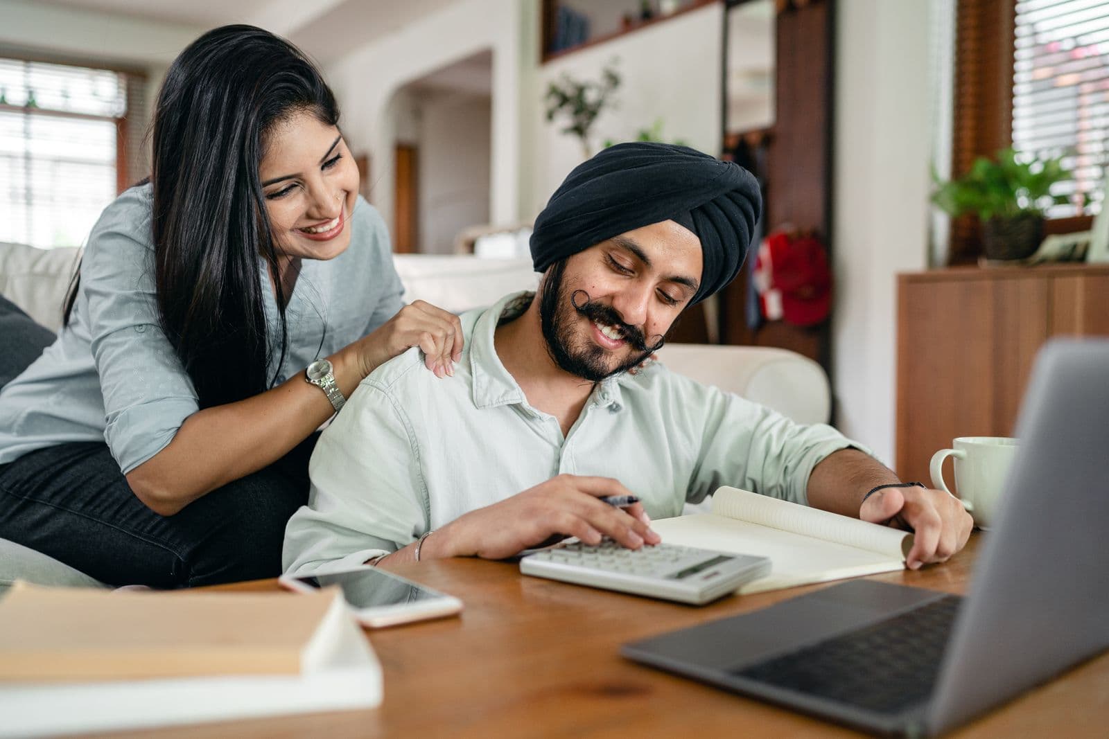 A couple organizing several financial statements